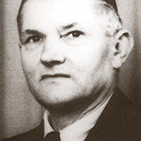 Das Bild zeigt den ehemaligen Bürgermeister Konrad Volm mit Anzug und Krawatte.